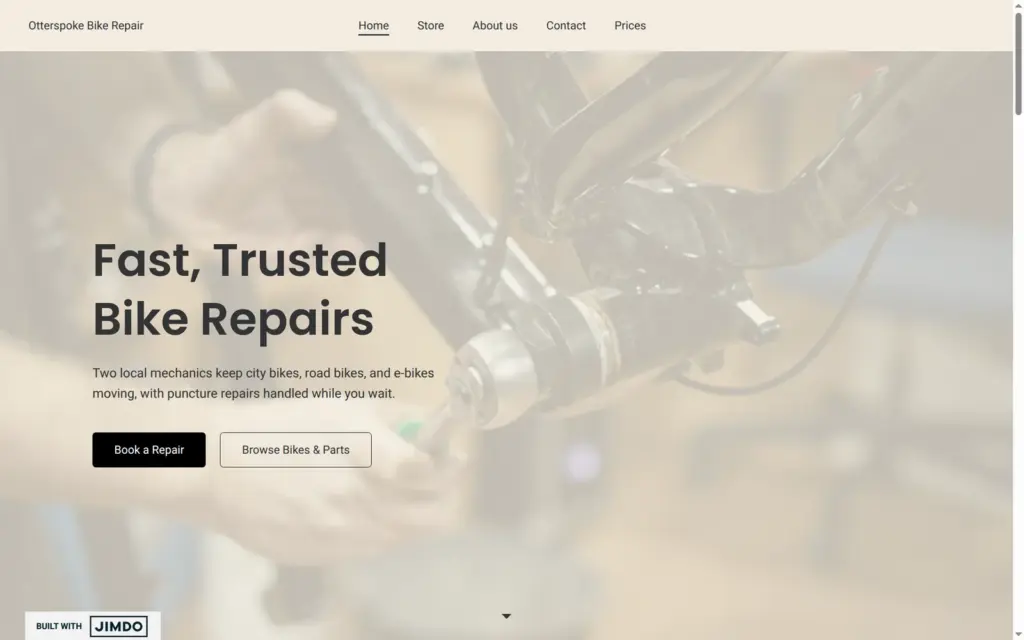 Home page of the Otterspoke Bike Repair demo site built with Jimdo, on a computer