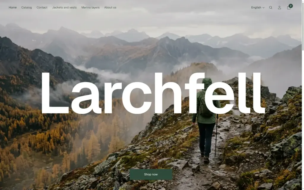 Home page of the Larchfell shop with a large photo of a hiker on a misty mountain ridge