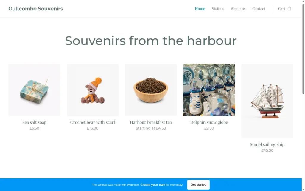 Home page of the Gullcombe Souvenirs demo shop built with Webnode, on a computer